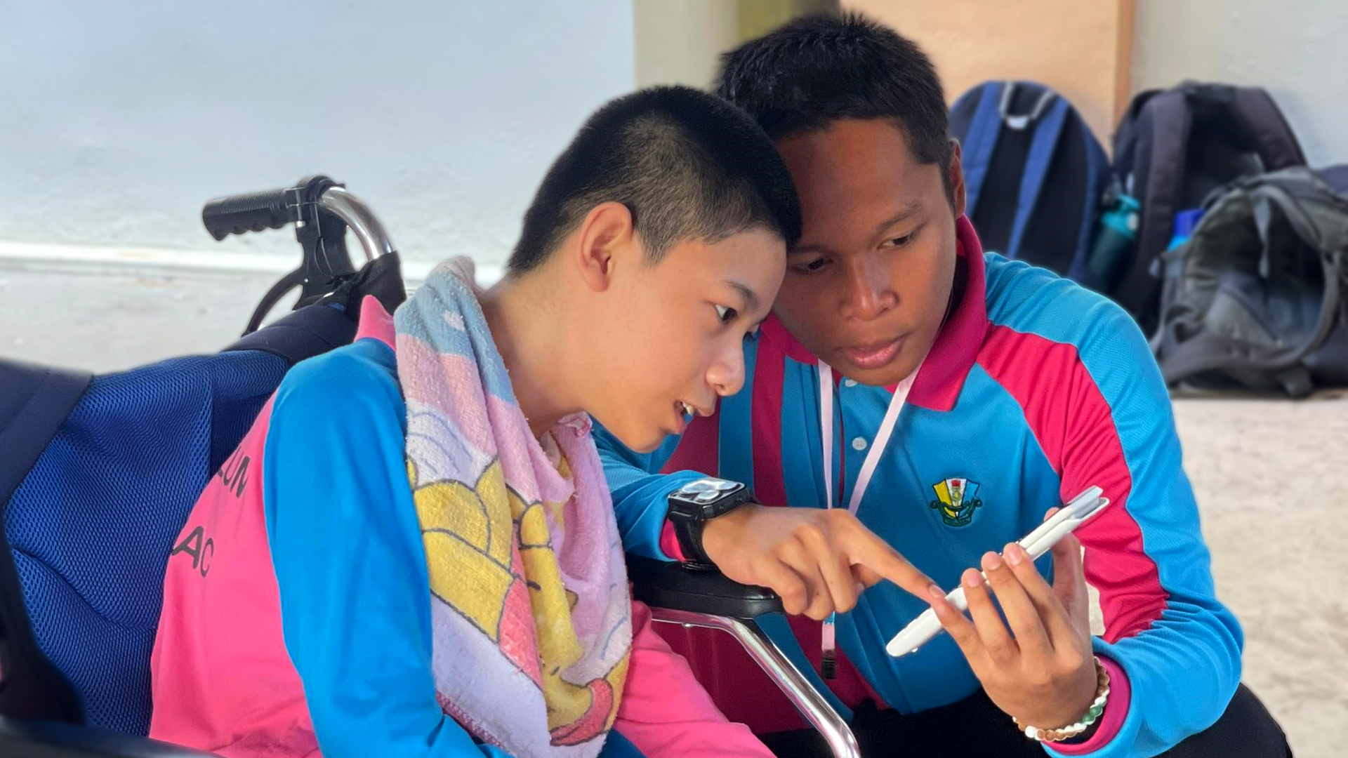 A teacher reviews a list co-created by a special needs student and his mentor, exploring the safety of irradiated foods and fostering a deeper understanding of nuclear science and technology