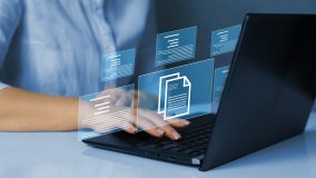 A person using a computer to access a database