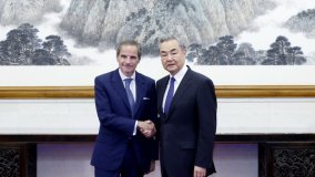 IAEA Director General Rafael Mariano Grossi and China’s Foreign Minister Wang Yi in Beijing