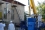A crane operator lifts and maneuvers the interim transfer cask to its place on top of the SKODA VPVR/M spent fuel shipment container.  (Photos:  Franti?ek Sviták/UJV-Rez)